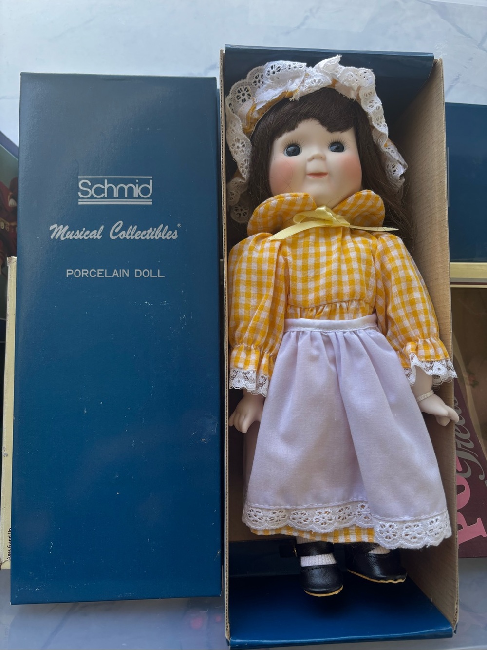 Schmid Yellow Gingham Porcelain Musical Doll with White Apron